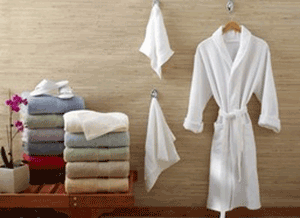 Towels, flowers, and robes displyed at a day spa